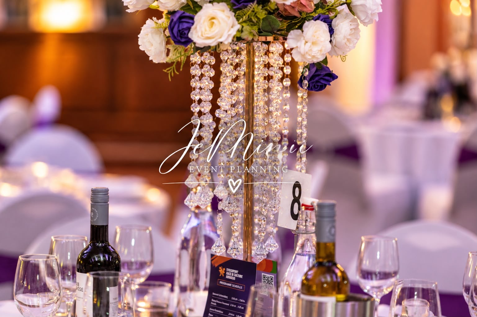 Formal dinner table with crystal bead stand centrepiece and purple roses, styled by Jeminii Event Styling in Manchester